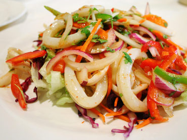 Squid with peppers and zucchini